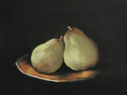 Two gold pears on a golden plate